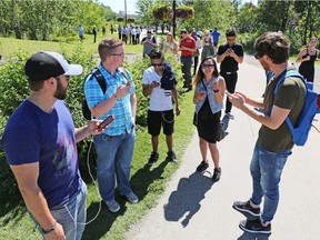 Dozens of Pokemon Go players play on Prince's Island in Calgary over the lunch hour on Tuesday July 19, 2016.