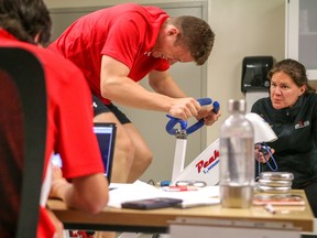 Calgary Flames draftee Matthew Tkachuk in fitness testing with sports physiologist Jessica Kryski at the Markin Macphail Centre in Calgary, Ab., on Monday July 4, 2016. Mike Drew/Postmedia