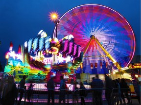 Night falls on the Calgary Stampede midway on Tuesday night July 12, 2016. Gavin Young/Postmedia