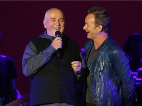 Peter Gabriel and Sting talk on stage during the Sting and Peter Gabriel Rock Paper Scissors tour at the Scotiabank Saddledome in Calgary on Saturday July 23, 2016.  Gavin Young/Postmedia