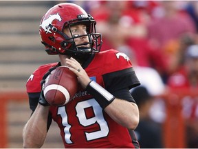 Calgary Stampeders quarterback Bo Levi Mitchell looks to pass against the BC Lions during first half CFL football action in Calgary, Friday, July 29, 2016.