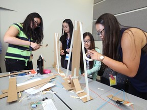 Students from left; Jessica Meng, An Xu, Liane Yan and Meagan Wen work on building a robot during the SHAD annual science/technology summer camp at the University of Calgary on Monday, July 4, 2016.
