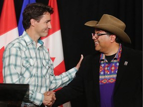 Prime Minister Justin Trudeau shakes hands with mayor Naheed Nenshi at Calgary City Hall Friday morning July 15, 2016 where they made a joint announcement on the  Calgary ring road.  (Ted Rhodes/Postmedia)