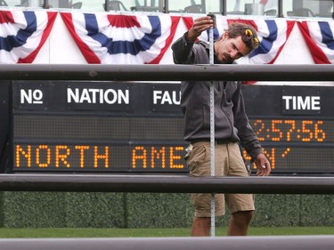 Axel Bescaromona from France, part of the jump crew, measures the rails on one of the jumps Tuesday July 5, 2016 prior to the Wednesday start of the Spruce Meadows North American.