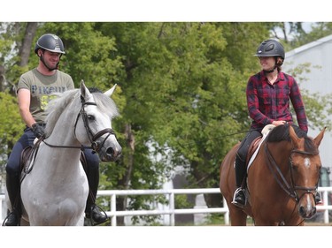 German rider Philipp Weishaupt and Canadian Olympic hopeful Kara Chad ride in the sand ring Tuesday July 5, 2016 prior to the Wednesday start of the Spruce Meadows North American.