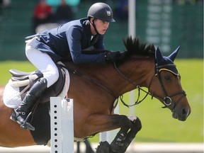 Daniel Coyle of Ireland rides Fortis Fortuna to victory in the AON Cup at the Spruce Meadows North American Wednesday afternoon July 6, 2016. (Ted Rhodes/Postmedia)