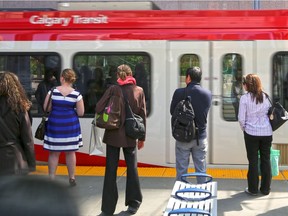 Commuters wait at the 4th Street S.W. CTrain station on Monday May 16, 2016.