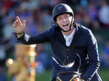 Ireland's Daniel Coyle waves to the crowd after winning the jump off to claim the Pepsi U25 Challenge on Somerset during the Spruce Meadows North American Friday July 8, 2016.