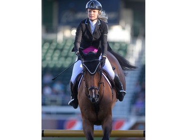 Canada's Tiffany Foster rides Cadalora in the Lafarge Cup during the Spruce Meadows North American Friday July 8, 2016.