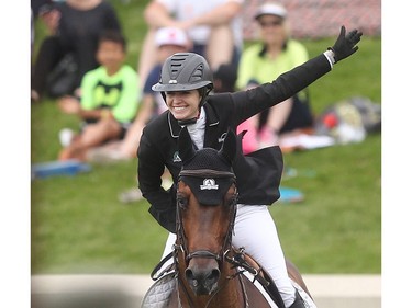 Canadian Tiffany Foster reacts at the end of her run which stood up to earn her victory in the Imperial on her horse Brighton Saturday July 9, 2016 during the Spruce Meadows North American.