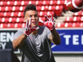 University of Calgary Dinos wide receiver Rashaun Simonise catches passes while being watched by six NFL scouts at McMahon Stadium in Calgary on Monday July 11, 2016. Simonise has been declared eligible for the NFL supplementary draft. Gavin Young/Postmedia