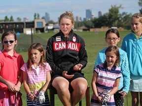With the help of an honour guard of young golfers, Brooke Henderson was announced as one of the members of the Canadian Olympic Golf Team at ceremony in Calgary on Tuesday July 19, 2016.  Gavin Young/Postmedia