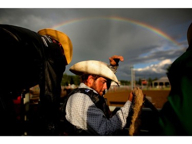 Nick Bentley gets ready to ride in saddle bronc during the Nanton Nite Rodeo in Nanton, Alta on June 25, 2016. Leah Hennel/Postmedia