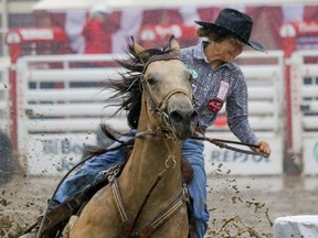 Mary Burger and Mo of Pauls Valley, Ok., won the barrel racing at the Calgary Stampede rodeo Sunday July 17, 2016. Mike Drew/Postmedia