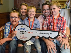 Fionn, Tina, Hugo, Kelvin, and Rhys Daly celebrate winning the Stampede Lottery Dream Home during a reception at Stampede Headquarters on Tuesday, July 26, 2016.