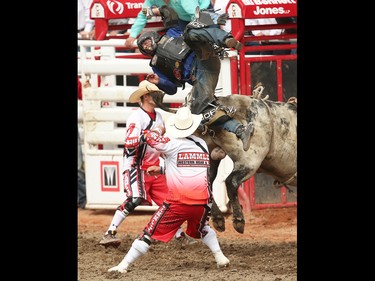 Oklahoma bullrider Ryan Dirteater is tossed from a bull named Scuttle Butt at the Calgary Stampede rodeo on Sunday, July 10, 2016.