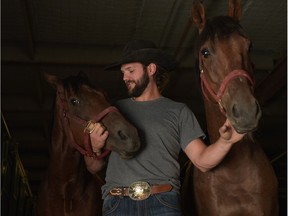 Chance Bensmiller with his horses in the chuckwagon barns at the 2016 Calgary Stampede on July 13, 2016.