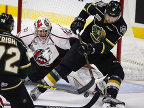 Rouyn-Noranda Huskies goalie Chase Marchan, left, looks on as London Knights' Matthew Tkachuk tries for a rebound during second period CHL Memorial Cup hockey action in Red Deer, Tuesday, May 24, 2016.THE CANADIAN PRESS/Jeff McIntosh ORG XMIT: JMC110