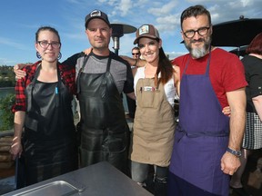 (L-R) Charbar head chef Jessica Pelland, Charbar co-chefs and co-owners John Jackson and Connie DeSousa and chef Fernando Trocca pose on the Charbar rooftop in Calgary.