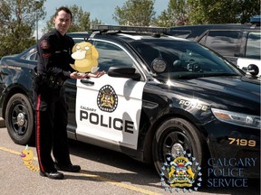 Const. Mark Smith with the Calgary Police Service's digital communications unit - pictured with a Psyduck and a Weedle - urges Calgarians to pay attention of their surroundings when playing Pokemon Go.