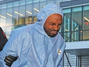 Police escort Edward Downey into the Court Services Section in downtown Calgary on Thursday July 14, 2016 after he was arrested in the murders of Taliyah Leigh Marsman  and her mother Sarah Baillie.