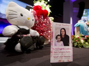 A program sits on a display table before a memorial service for Sara Baillie and her five-year-old daughter Taliyah Marsman at Centre Street Church in Calgary, Alta., on Thursday, July 21, 2016. Baillie and Marsman were killed in mid-July; Edward Downey faces charges. Lyle Aspinall/Postmedia Network