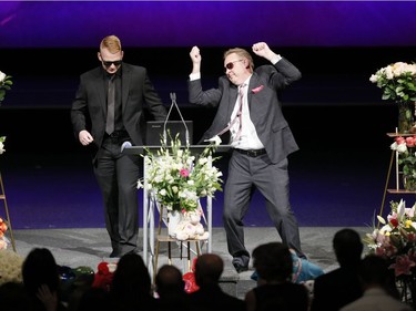 Scott Hamilton and his son Justin Hamilton (Sara Baillie's uncle and cousin) dance as a tribute during a memorial service for Baillie and Baillie's five-year-old daughter Taliyah Marsman at Centre Street Church in Calgary.