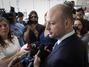 Defense lawyer Gavin Wolch speaks to the media about his client Edward Downey, charged with two counts of first degree murder in the deaths of Sara Baillie and her daughter Taliyah Marsman, following a court appearance in Calgary, Alta., Wednesday, July 20, 2016.THE CANADIAN PRESS/Jeff McIntosh ORG XMIT: JMC101