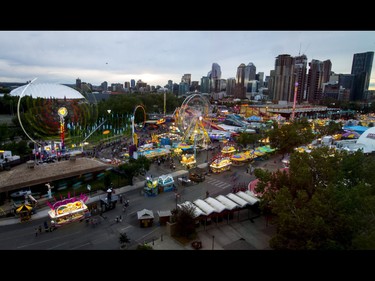 The midway  bustles during the Calgary Stampede Sneak-a-Peek in Calgary, Alta., on Thursday, July 7, 2016. Stampede would officially kick off the next day and last until July 17. Lyle Aspinall/Postmedia Network