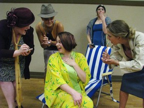 In The Drowsy Chaperone, Janet tells reporters she's giving up the stage for love while a Drowsy Chaperone looks on. From left, Maddy Quinn, Lara Xavier, Celia Niksic, Emily Sunderland, Julia Caddy.