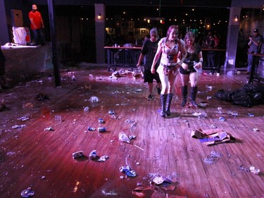 Fans walk through the aftermath of the Insane Clown Posse show at the Marquee Beer Market in Calgary, Alta. on Tuesday July 12, 2016.