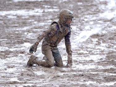 It was a muddy day during the wild pony racing at the Calgary Stampede on Saturday July 16, 2016.