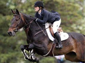 Jennifer Gates of USA, the daughter of Bill Gates, rides Cadence during the Direct Energy competition at the Spruce Meadows North American Wednesday July 6, 2016.