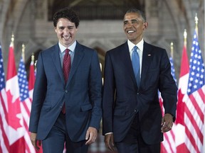 U.S. President Barack Obama and Prime Minister Justin Trudeau walk down the Hall of Honour on Parliament Hill in Ottawa on June 29.