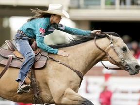 Lisa Lockhart of Oelrichs, S.D., puts in the best time in barrel racing on Day 5 of the Calgary Stampede Rodeo in Calgary, Alta., on Tuesday, July 12, 2016. Cowboys compete for 10 days for a piece of the rodeo's $2 million in prize money. Lyle Aspinall/Postmedia Network