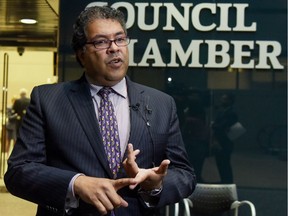 Mayor Naheed Nenshi speaks to reporters outside the council chambers in Calgary.