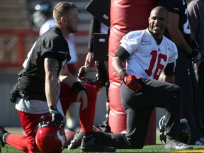 CALGARY, AB.; OCTOBER 8, 2015 --  Calgary Stampeders receiver Marquay McDaniel, right,  chats with quarterback Bo Levi Mitchell at practice Thursday October 8, 2015 at McMahon Stadium. (Ted Rhodes/Calgary Herald) For Sports story by Rita Mingo. Trax # 00069101C