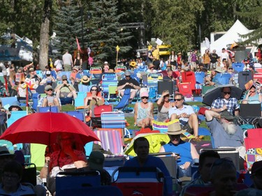 Musc fans relax in the sunshine as they enjoy opening night at Calgary Folk Festival 2016 on Prince's Island in Calgary, Alta. on Thursday, July 21, 2016. Saffron likes to wrap up her baby like her mother.