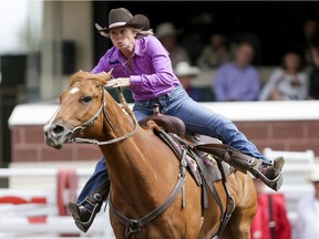 Nancy Csabay puts in the day's fastest time (17.56 seconds) in barrel racing on Day 6 of the Calgary Stampede Rodeo in Calgary, Alta., on Wednesday, July 13, 2016. Cowboys compete for 10 days for a piece of the rodeo's $2 million in prize money. Lyle Aspinall/Postmedia Network