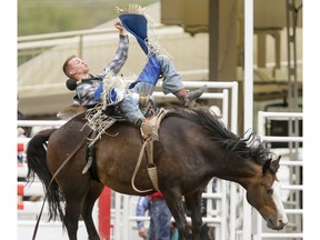 Orin Larsen of Inglis, Man., puts in the day's best score (86.5) on Gypsy Soul in the bareback event on Day 6 of the Calgary Stampede Rodeo in Calgary, Alta., on Wednesday, July 13, 2016. Cowboys compete for 10 days for a piece of the rodeo's $2 million in prize money. Lyle Aspinall/Postmedia Network