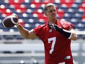 Ottawa Redblacks' QB, Trevor Harris, looks for a receiver during practice at TD Arena Wednesday July 06, 2016. (Darren Brown/Postmedia)