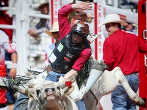 Kindersley,Saskatchewan bullrider Dakota Buttar rides a bull named Houdini Magic at the Calgary Stampede rodeo on Friday, July 8, 2016. AL CHAREST/POSTMEDIA