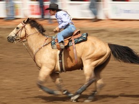 Mary Burger of Pauls Valley, OK, during the barrel racing event at the Calgary Stampede rodeo on Sunday, July 10, 2016. AL CHAREST/POSTMEDIA