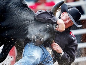 Donalda bulldogger Curtis Cassidy during the steer wrestling eventplanted his steer in a time of 3.7 seconds to win top money on Day 4 of the steer-wrestling event at the Calgary Stampede rodeo on Monday, July 11, 2016. AL CHAREST/POSTMEDIA