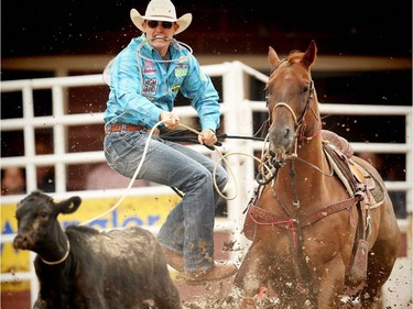 Tuf Cooper of Decatur, TX, posted the top time ( 8.5 seconds) on Day 9 of the tie-down roping event at the Calgary Stampede rodeo on Saturday, July 16, 2016.