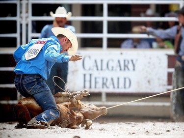 Hunter Herrin of Apache, OK, posted the top time ( 7.7 seconds) on Day 9 of the tie-down roping event at the Calgary Stampede rodeo on Saturday, July 16, 2016.