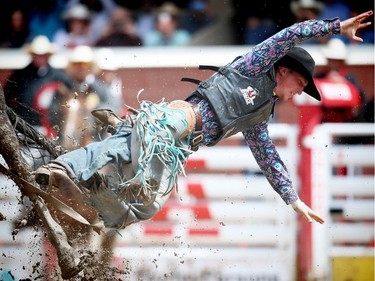 Montana cowboy Jace Cooley is bucked off Star Rocket during the novice bareback event  on Day 9 at the Calgary Stampede rodeo on Saturday, July 16, 2016.