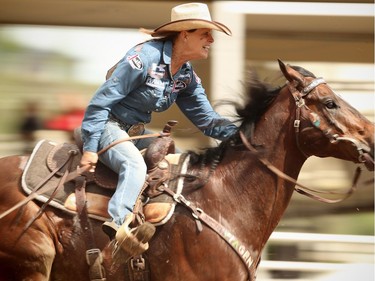 Mary Walker of Ennis, TX, sailed around the barrels in a time of 17.94 seconds during Day 9  barrel-racing action at the Calgary Stampede rodeo on Saturday, July 16, 2016.