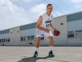 Ross Bekkering, a southern Alberta professional basketball player,  is retiring from the game. He posed for pictures in his uniform at an outdoor court in Calgary, Ab., on Saturday July 2, 2016. Mike Drew/Postmedia