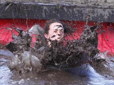 Postmedia Calgary's Emma McIntosh competes during Rugged Maniac 5k Obstacle Race & Mud Run held at Spruce Meadows in Calgary, Alta on Saturday July 30, 2016. The event features about 30 different obstacles.  McIntosh completed the event in about 1:15:00. Jim Wells/Postmedia